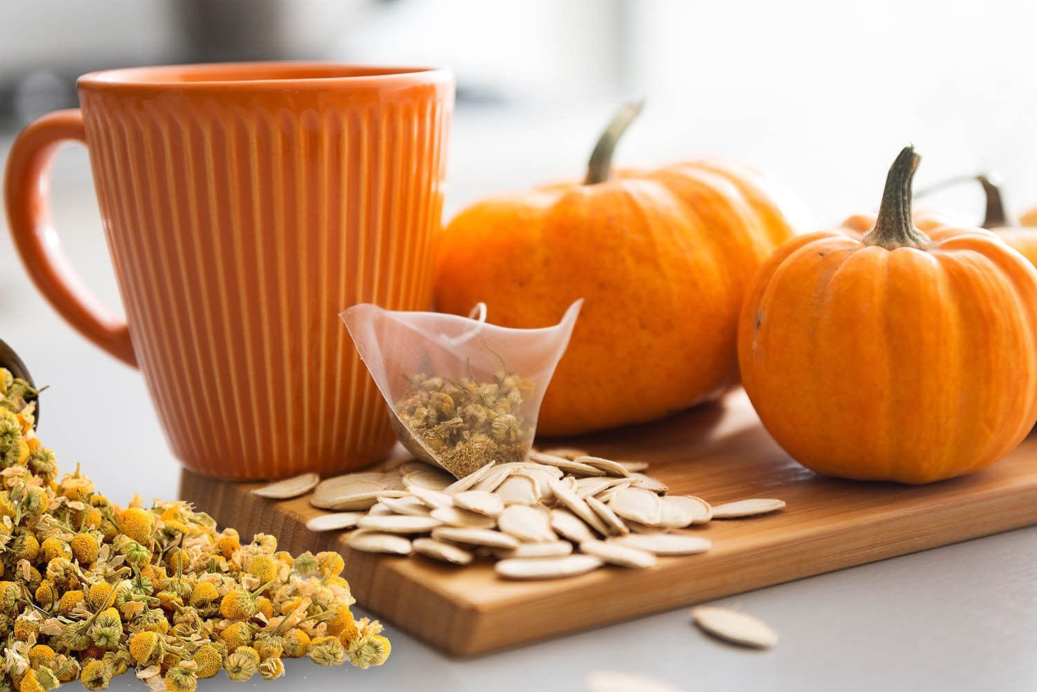 Closeup on small pumpkins seeds and tea bag on table